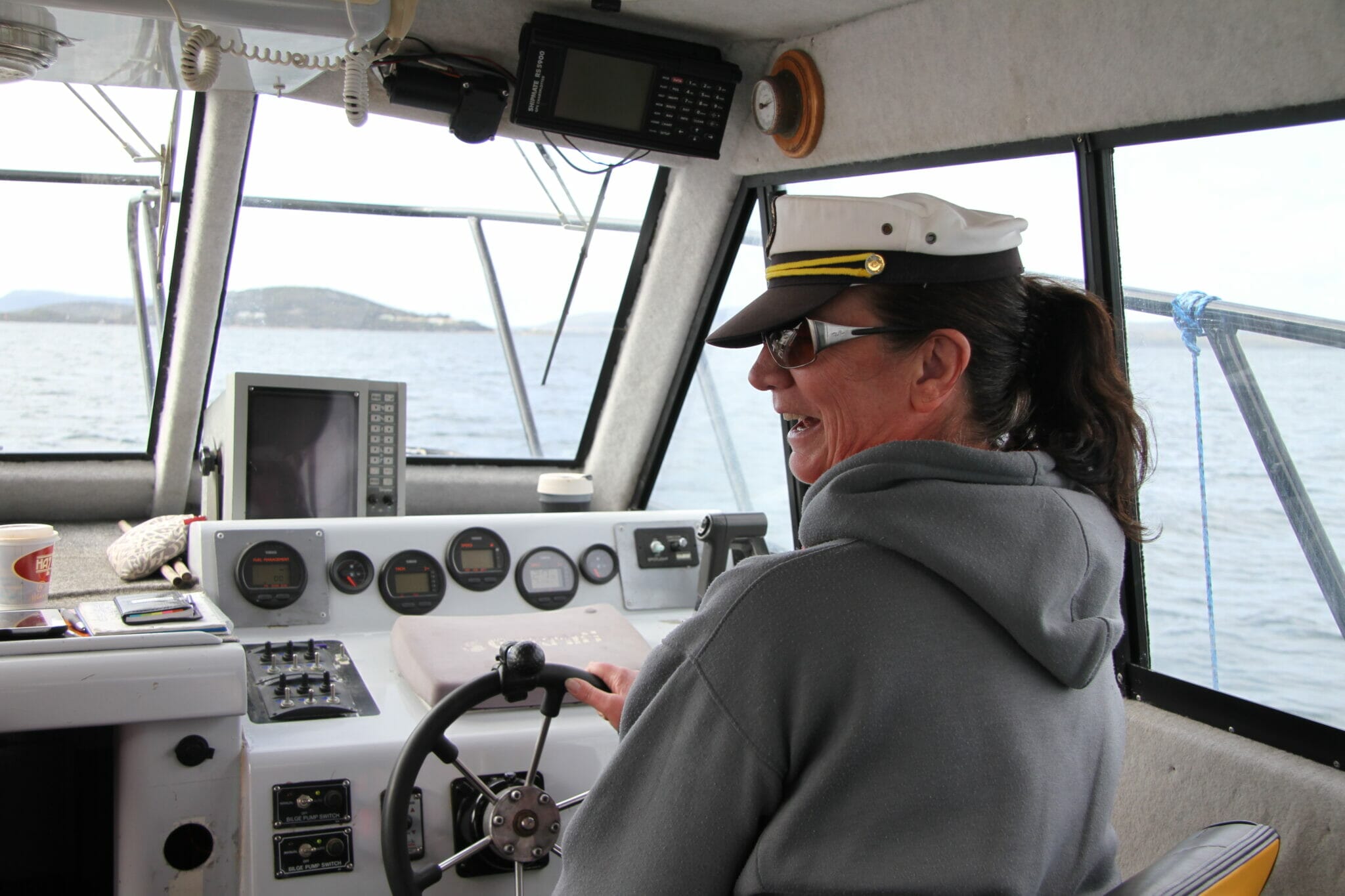Captain of the day - One of our guests at the helm of the Young Salty Dog